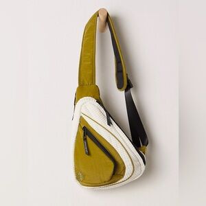 sold NWT Free People Movement green cold shoulder sling bag